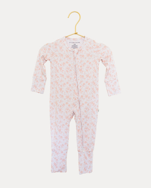 Blush Blossoms bamboo zip sleeper on a hanger, soft pink floral print