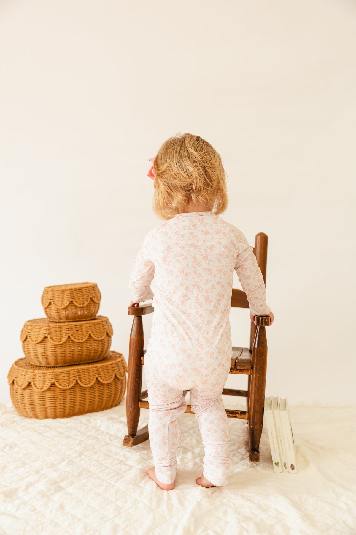 Back view of the Blush Blossoms sleeper on a toddler