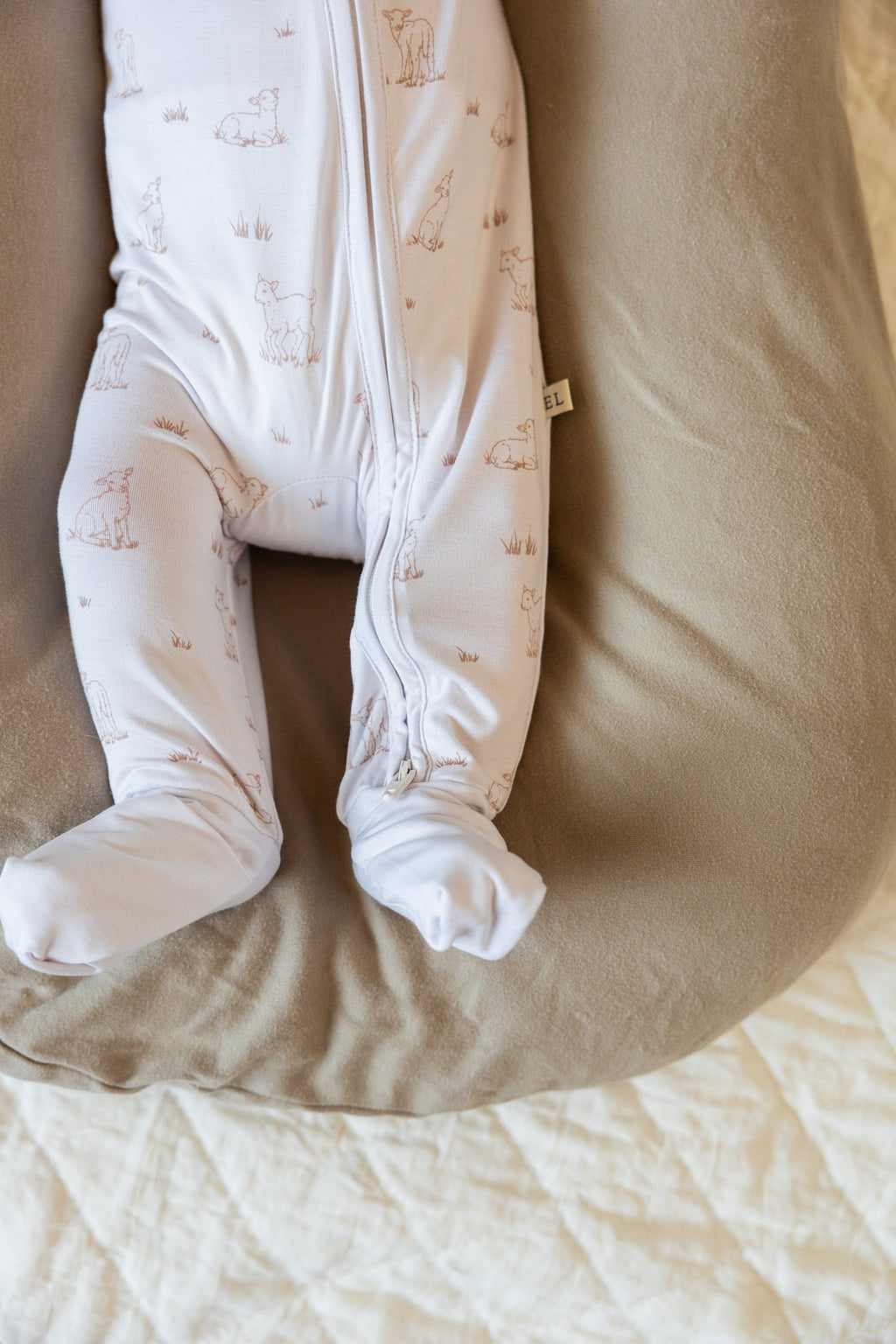 Footed Little Lamb sleeper on a newborn