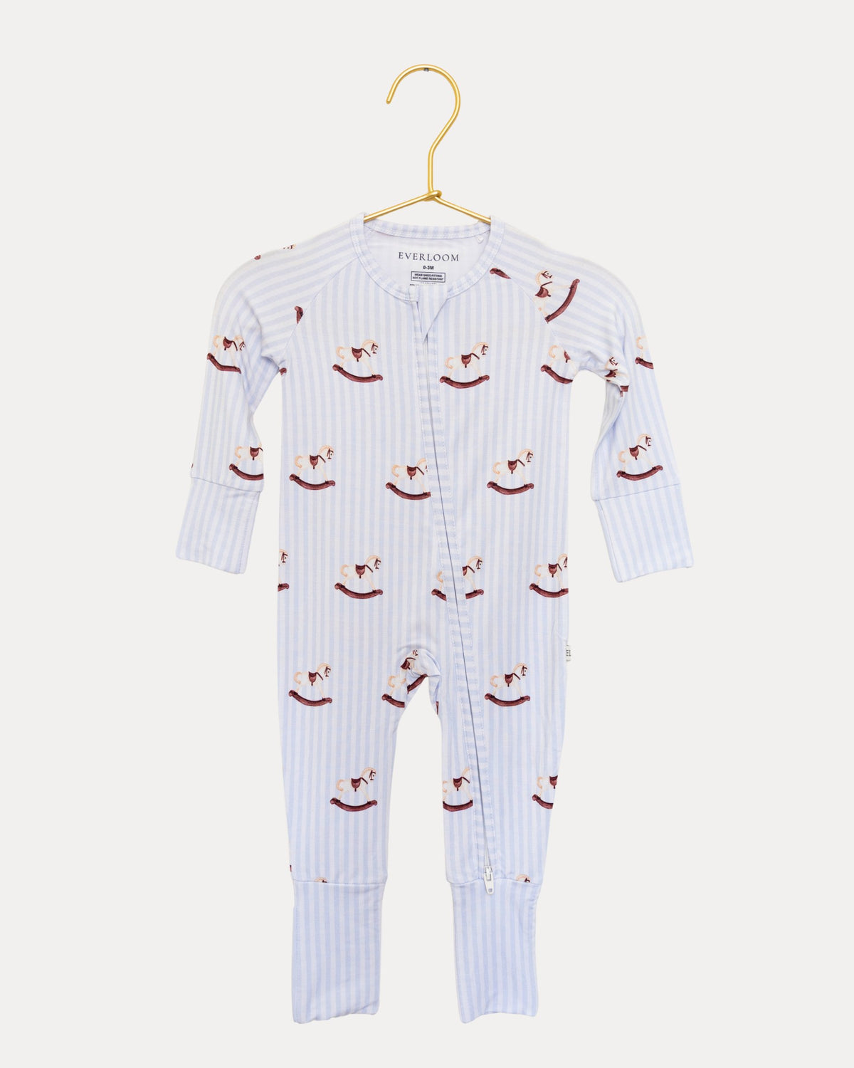 Rocking Horse bamboo zip sleeper on a hanger, rocking horses on soft blue stripes