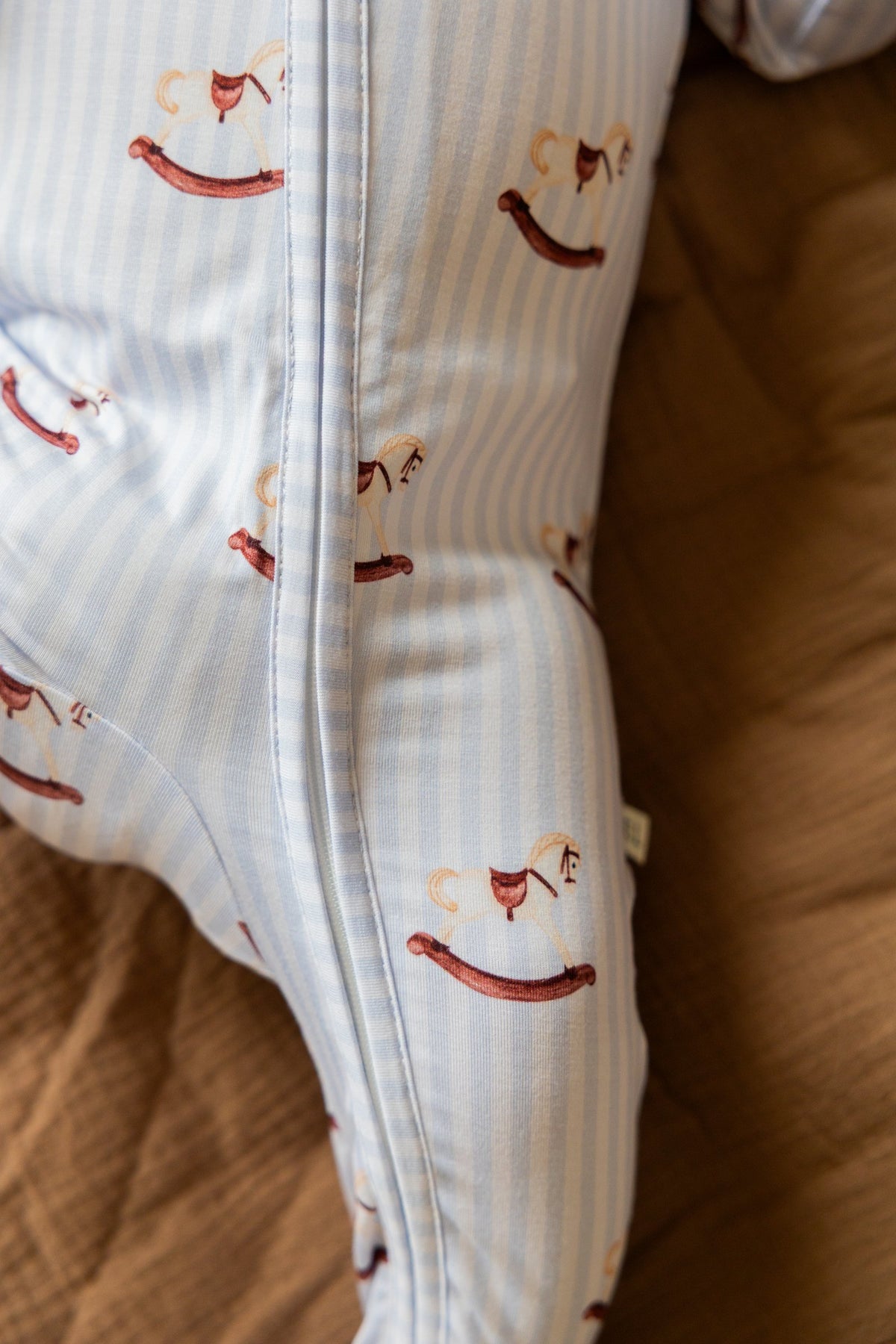 Close-up of the Rocking Horse print and double zipper