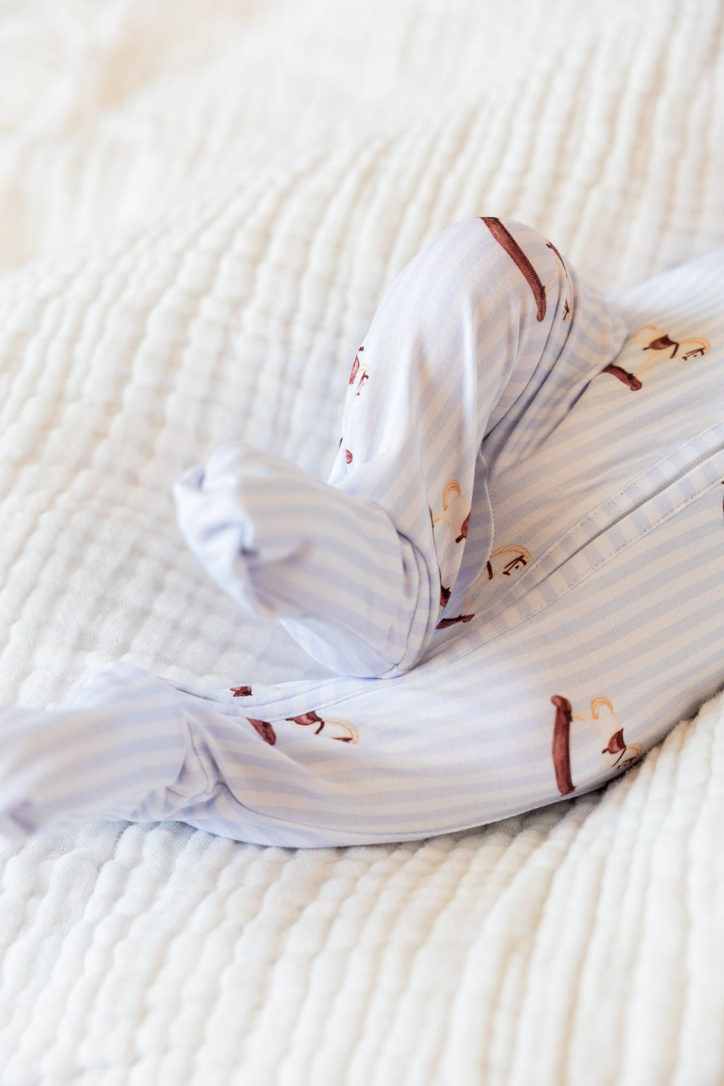 Footed Rocking Horse sleeper on a baby, detail